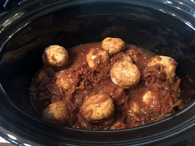 Crock pot with frozen turkey meatballs and French onion soup.
