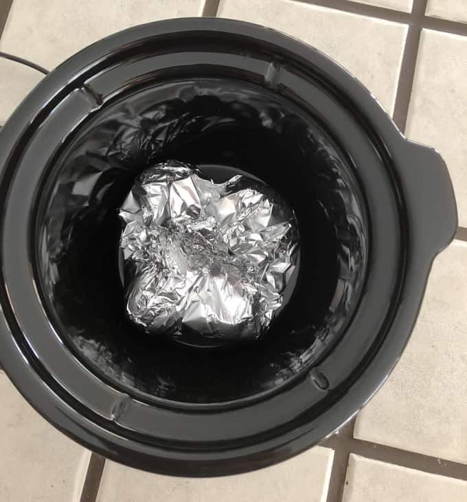 Fresh Cut Garlic Cloves Wrapped Tin Foil Packets in bottom of Crock Pot