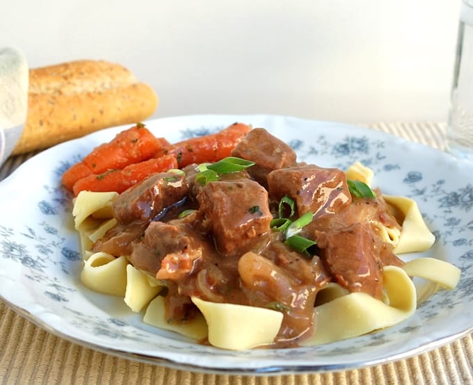 Beef and Beer Carbonnade over noodles with roasted carrots and baguette