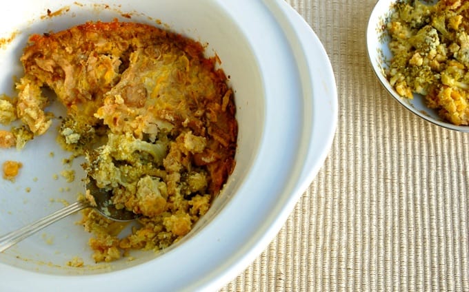 Broccoli Corn Casserole in a serving dish with a large serving spoon