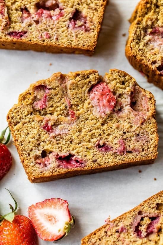 slices of roasted strawberry banana bread arranged on parchment paper