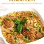 Casserole dish with chicken thighs and creamy corn topped with fresh basil