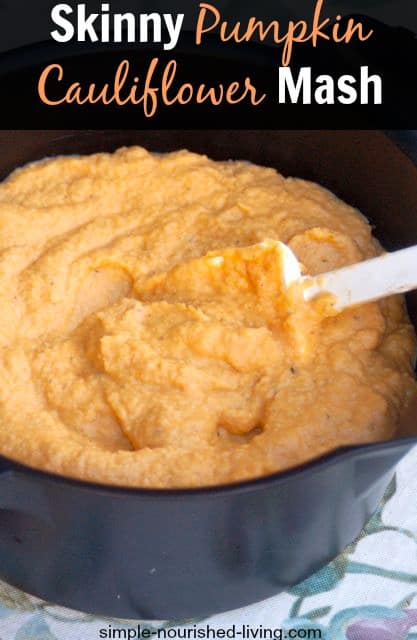 Skinny Pumpkin Cauliflower Garlic Mash in serving bowl with spatula.