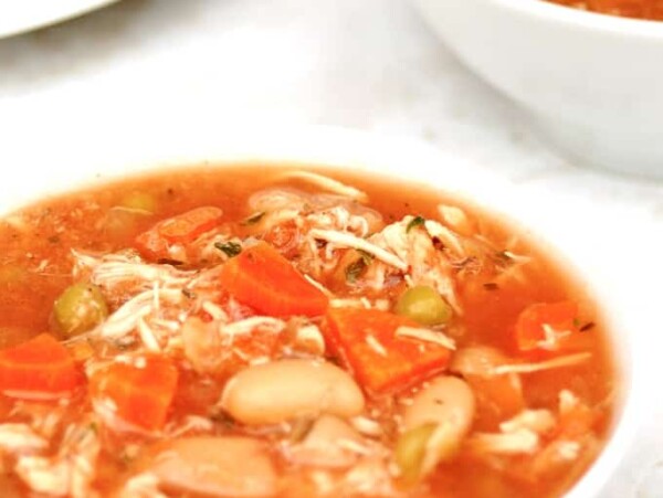 slow cooker chicken vegetable soup in a white bowl