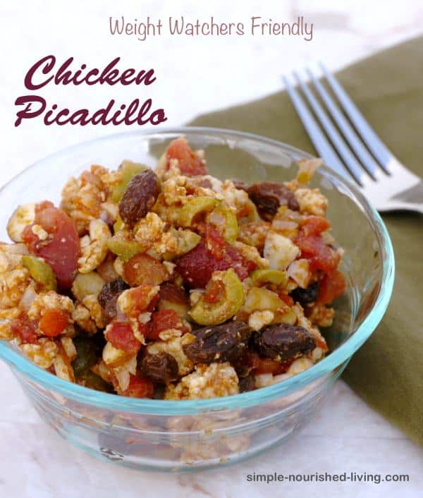 Chicken Picadillo in bowl with fork.