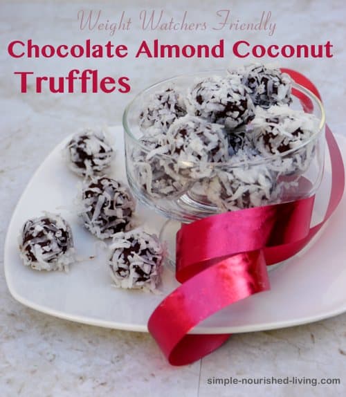 Easy Chocolate Almond Coconut Truffles in glass serving dish with red ribbon.