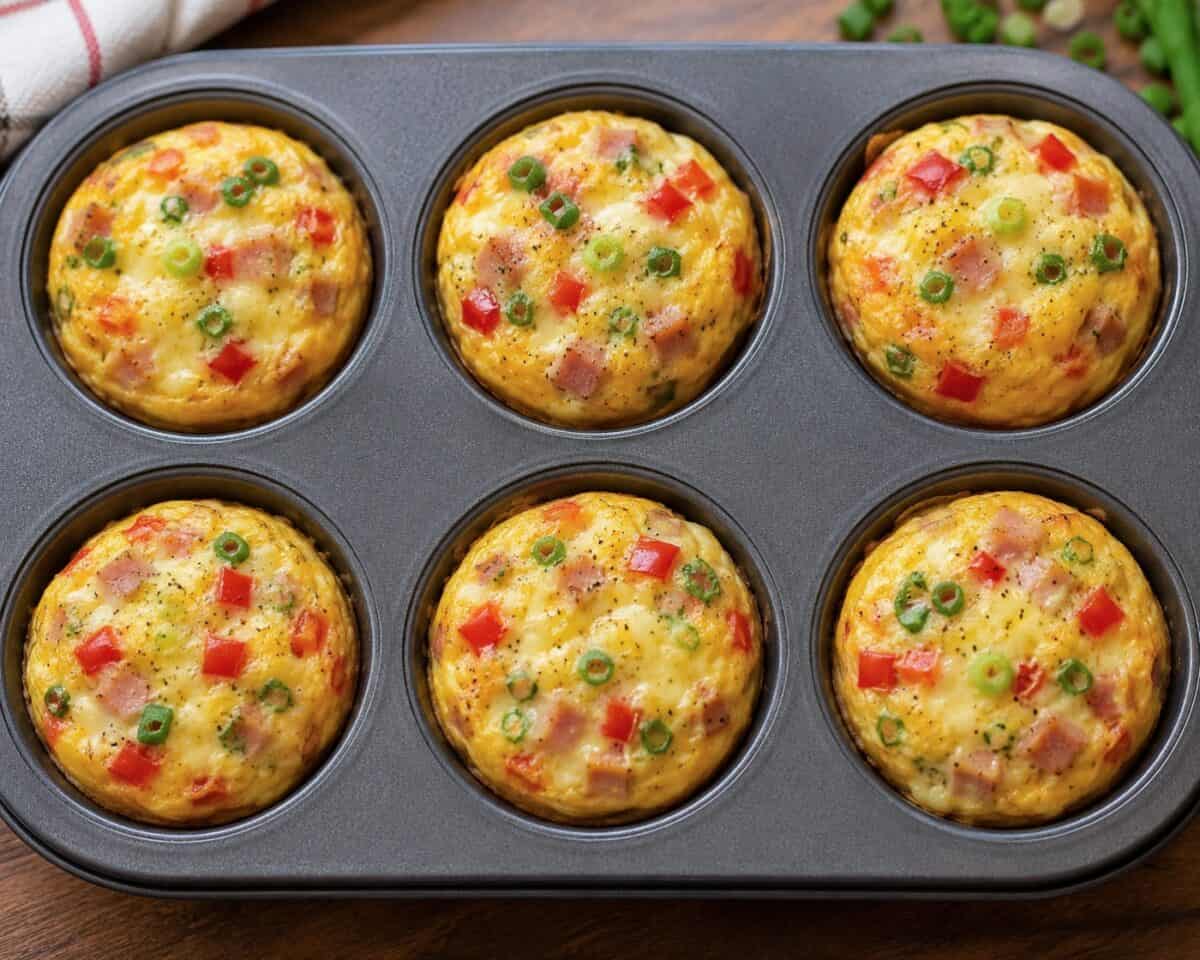 Standard 6-cup muffin pan with freshly baked Western Omelet Muffins.