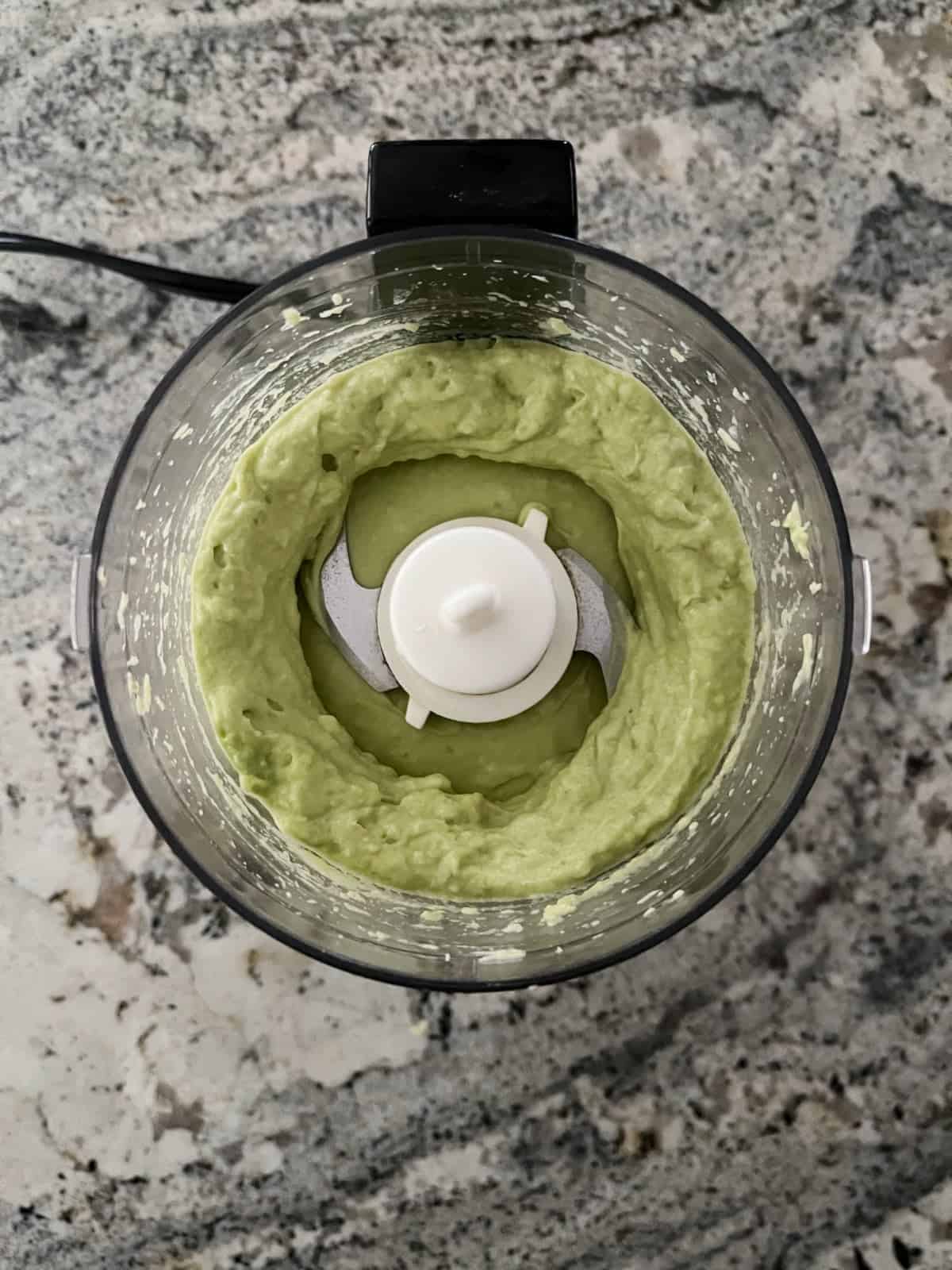 Whipping avocado in food processor.