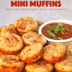 Pepperoni pizza mini muffins on white serving platter with marinara dipping sauce.