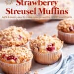 Strawberry streusel muffins on light blue plate