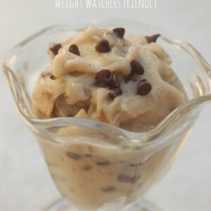 Low Calorie Banana Ice Cream in a clear parfait glass on white background
