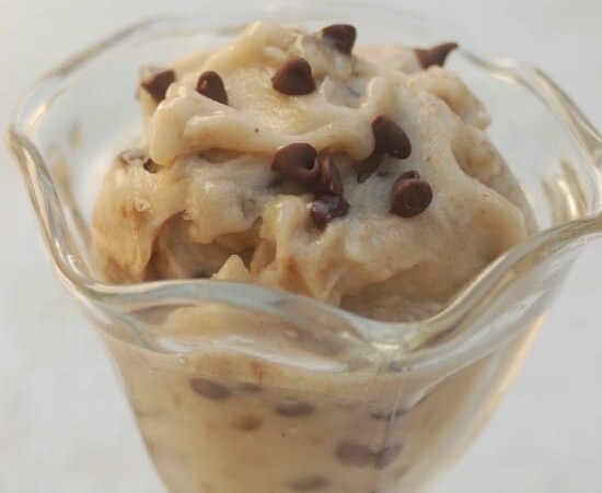 Low Calorie Banana Ice Cream in a clear parfait glass on white background
