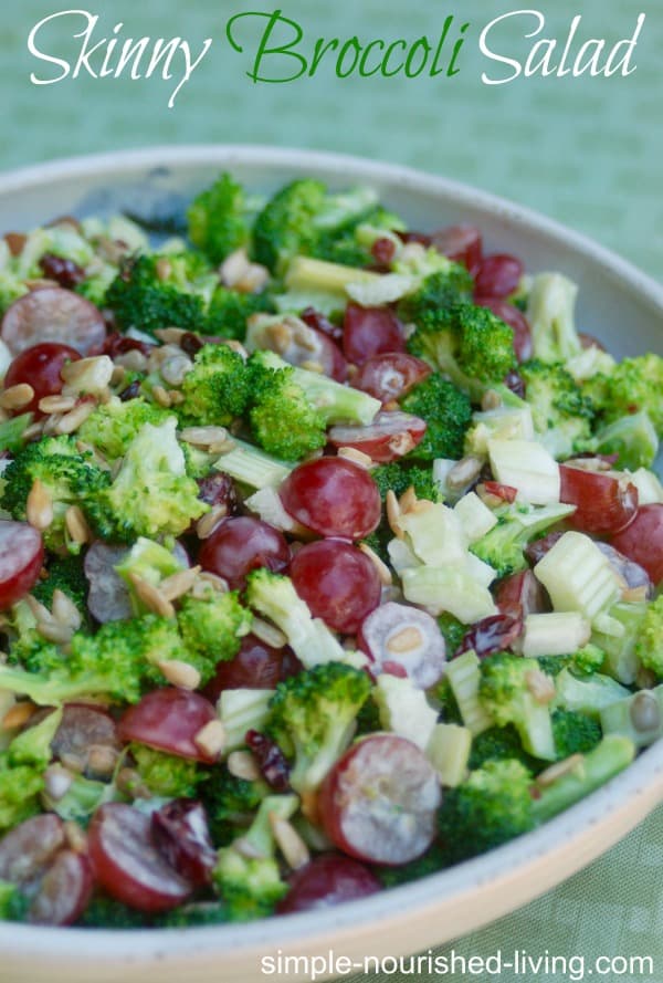 skinny broccoli salad in a ceramic bowl with green background
