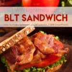 BLT sandwich on brown napkin with whole tomato and second BLT in background.