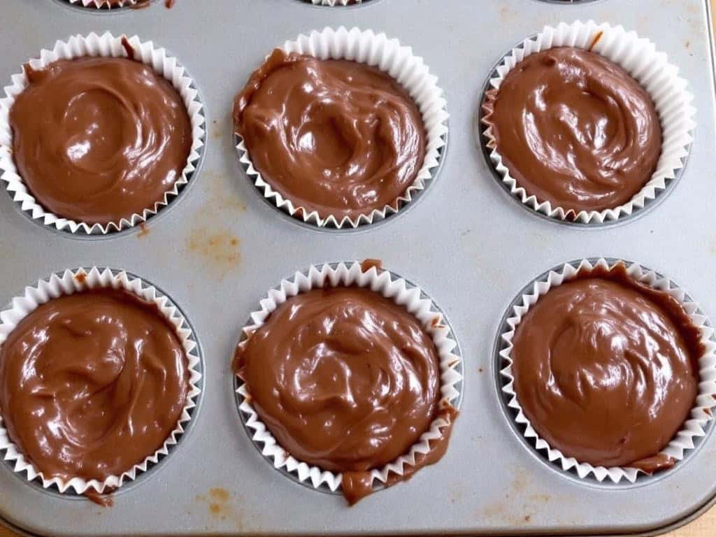 chocolate muffins in muffin pan ready to bake from above