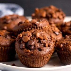 a plate of chocolate pumpkin muffins