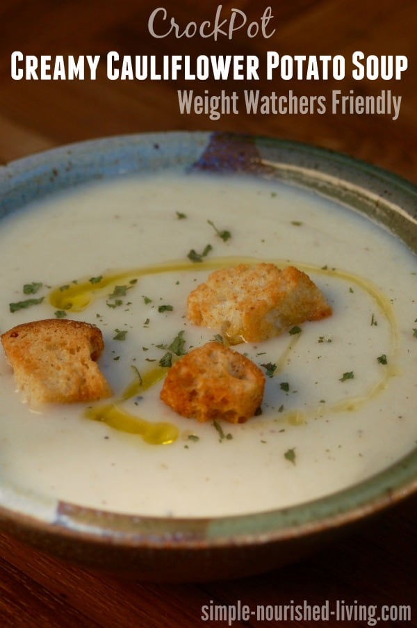 CrockPot Creamy Cauliflower Potato Soup topped with croutons and olive oil drizzle.