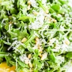 Simple Arugula Salad with Sunflower Seeds and Parmesan close up from above
