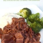 Balsamic braised beef with steamed broccoli and mashed potatoes on white dinner plate.