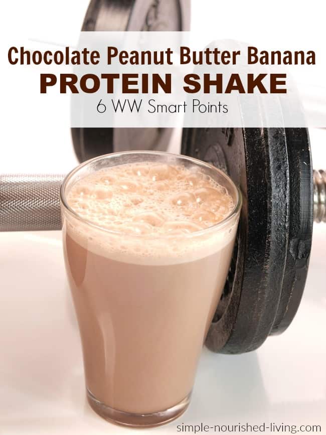 Chocolate peanut butter banana cottage cheese protein shake next to dumbbells.