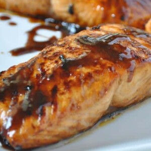 Honey Glazed Salmon on white plate from the side close up