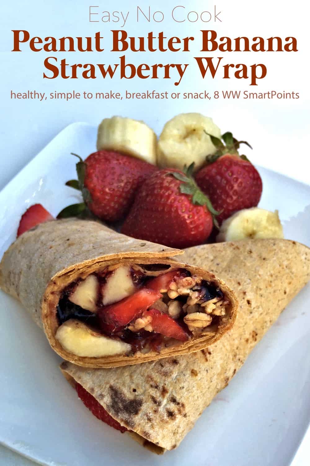 Peanut Butter Banana Strawberry Wrap cut in half on plate with fresh strawberries and banana slices.