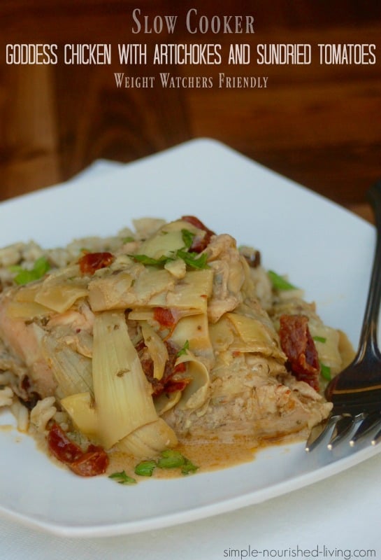 Slow Cooker Goddess Chicken Artichokes Sundried Tomatoes Weight Watchers in square white plate with fork