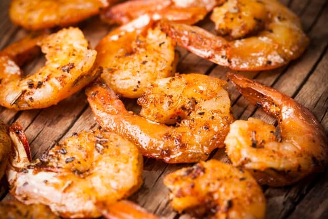 Skinny Southern BBQ Shrimp on wooden table.