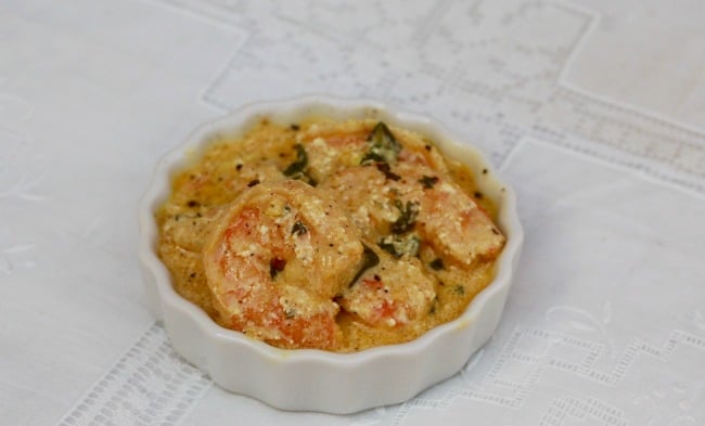 Curried Shrimp with Cilantro in small white dish.
