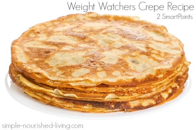 Stack of crepes on white plate.