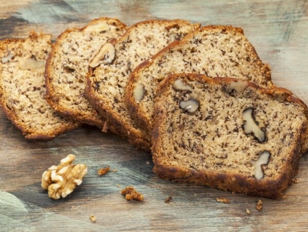 Slices of fresh banana bread with walnut on a cutting board