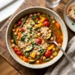 bowl of slow cooker summer minestrone with spoon shot from above