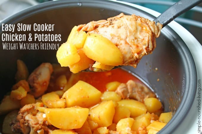 Easy slow cooker chicken and potatoes in crock with spoon.
