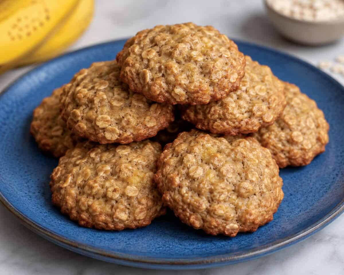 Banana Oatmeal Cookies stacked on a blue plate.