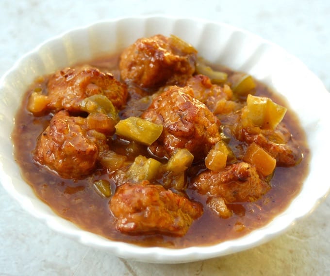 Slow Cooker Hawaiian Meatballs in a Pineapple Teriyaki Sauce in a white serving bowl