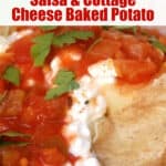 Close up of baked potato topped with salsa and cottage cheese garnished with parsley