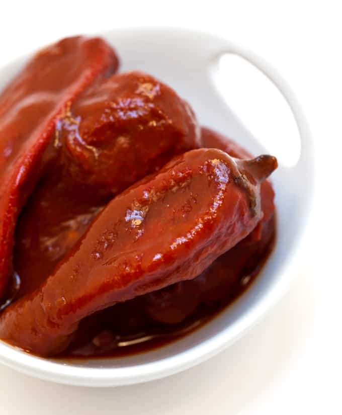 Chipotle peppers in adobo sauce in a white dish