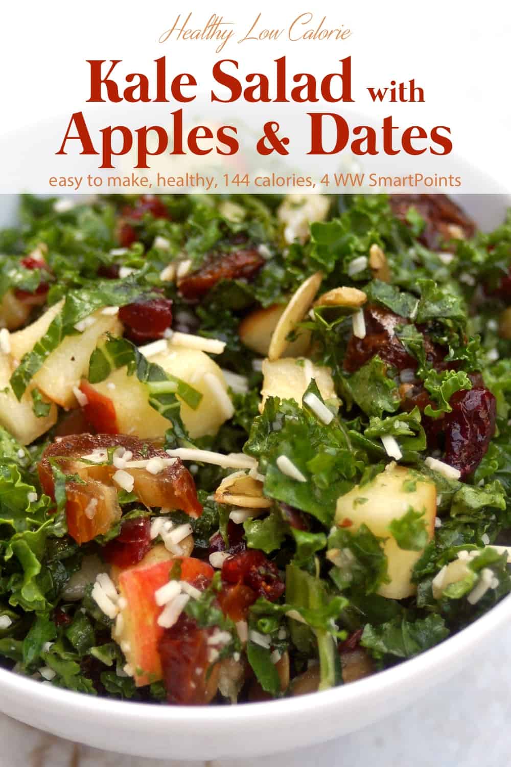 Kale salad with chopped fresh apples and dates in white serving bowl.