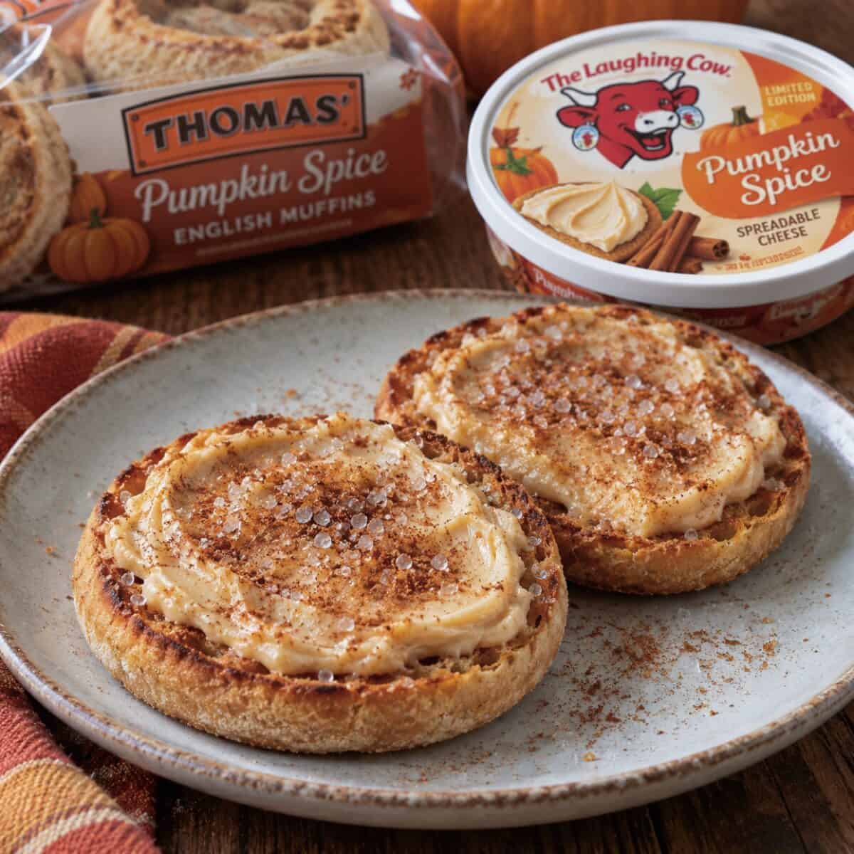 Pumpkin Spice English Muffin Cheese Danish with a package of Thomas' Pumpkin Spice English Muffins and package of Laughing Cow Pumpkin Spice spreadable cheese.
