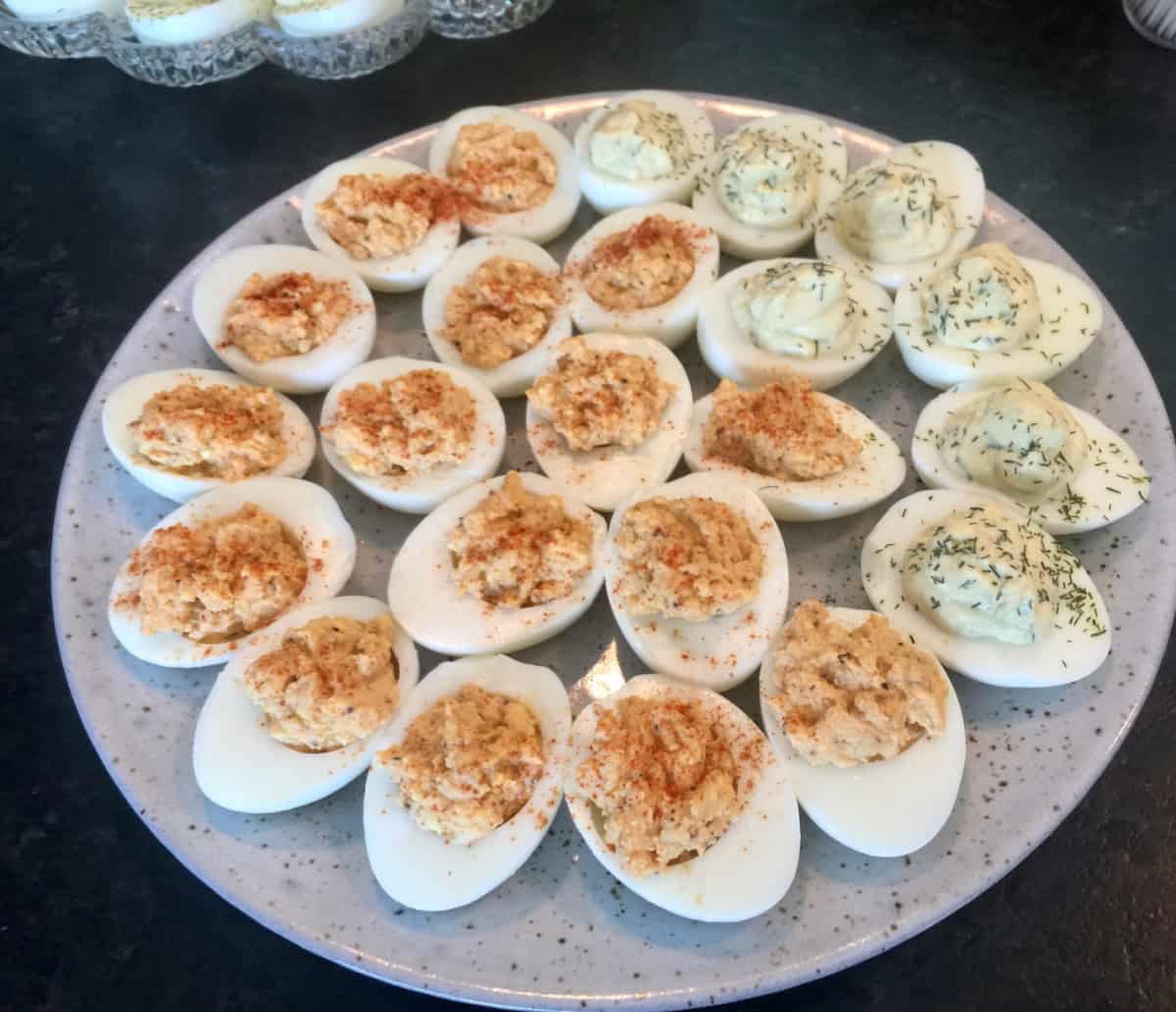 Platter of Deviled Eggs Garnished with Paprika and Dill