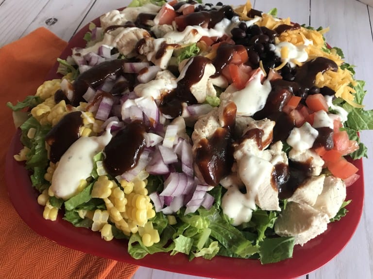 Salad with chicken, Corn, Black Beans drizzled with BBQ Sauce and Ranch Dressing