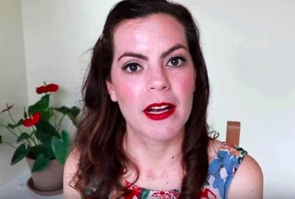 Portrait shot of Olivia Hayward in sleeveless print dress