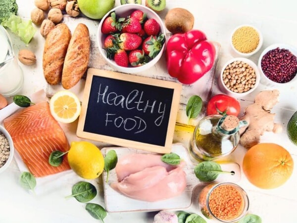 a variety of healthy foods on white background
