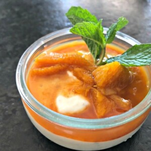 skinny cardamom yogurt pudding topped with oranges and mint