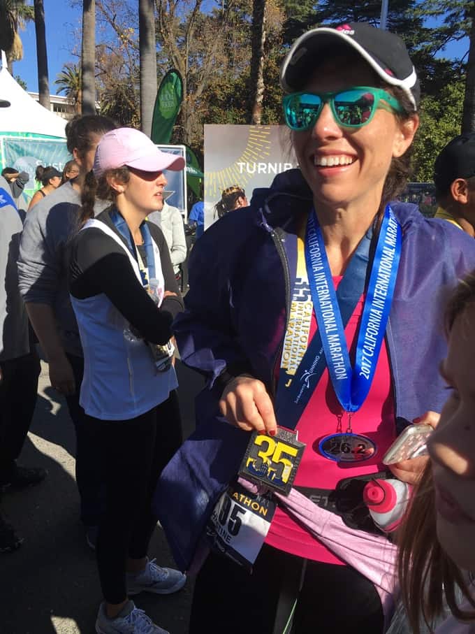 Christine finishing a marathon