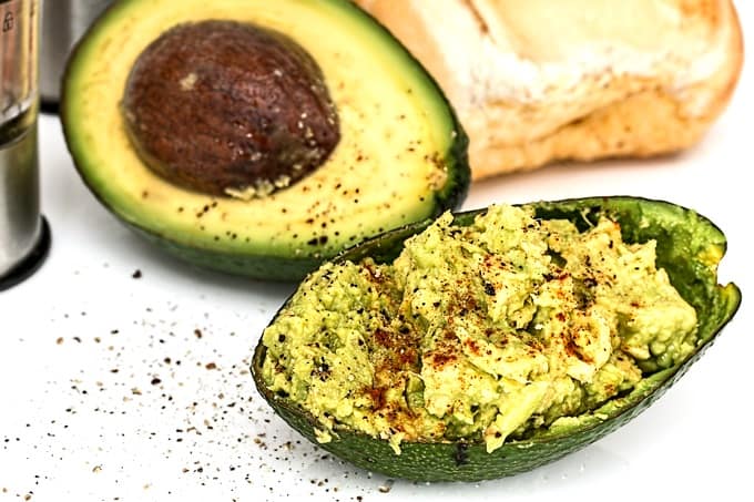 Smashed avocado with salt, pepper and spices