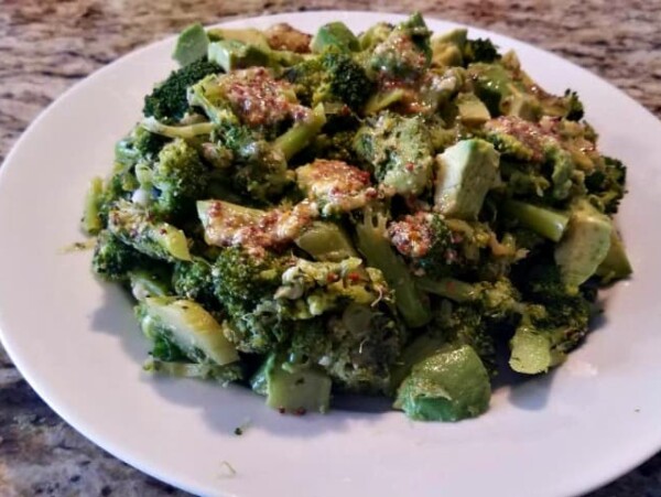 broccoli avocado salad on white plate