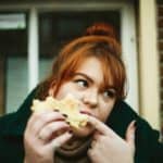woman eating sandwich mindful