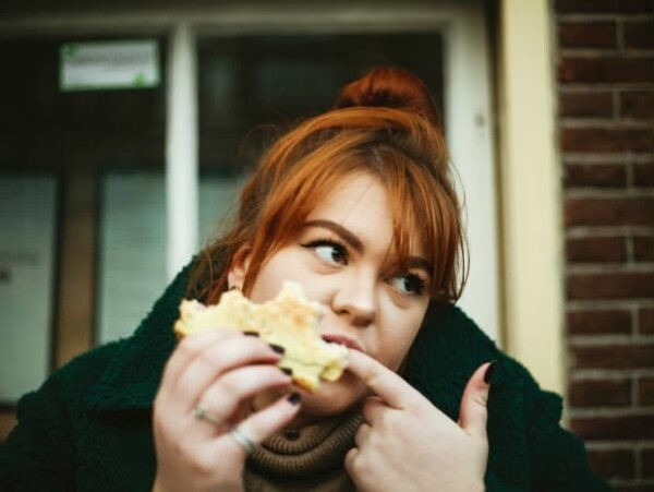 woman eating sandwich mindful