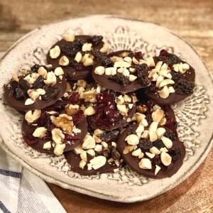 low sugar fruit and nut chocolates on pottery plate